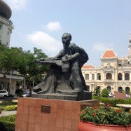 Ho Chi Minh with child statue in front of City Hall.