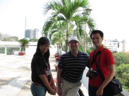 Me with My, and Khoa on the roof terrace of the Reunification Palace.